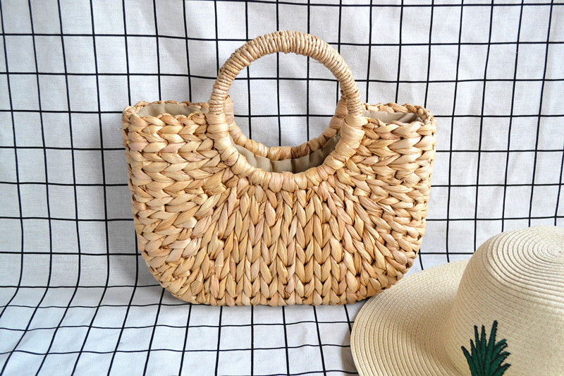 2022 New Corn Husk Braided Fringed Fur Ball Bag Women's Summer Straw Bag Holiday Bag